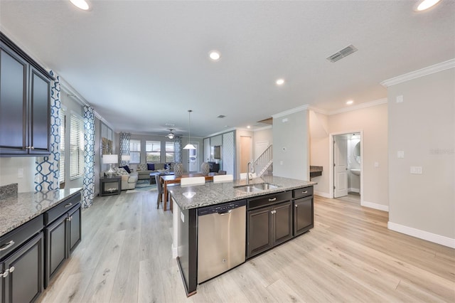 kitchen with light stone countertops, visible vents, ceiling fan, a sink, and dishwasher