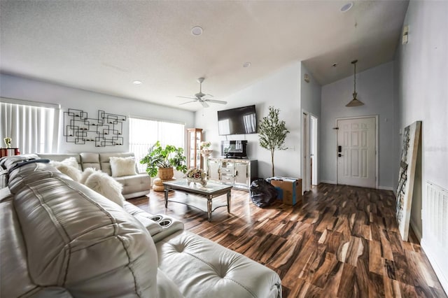 living room featuring vaulted ceiling, ceiling fan, baseboards, and dark wood-type flooring