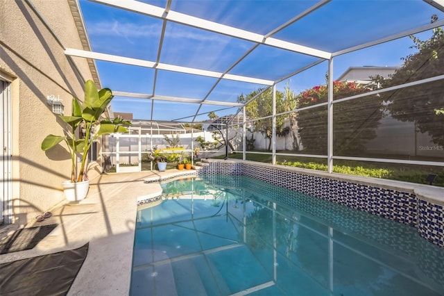 view of swimming pool with a patio area, a lanai, and a fenced in pool