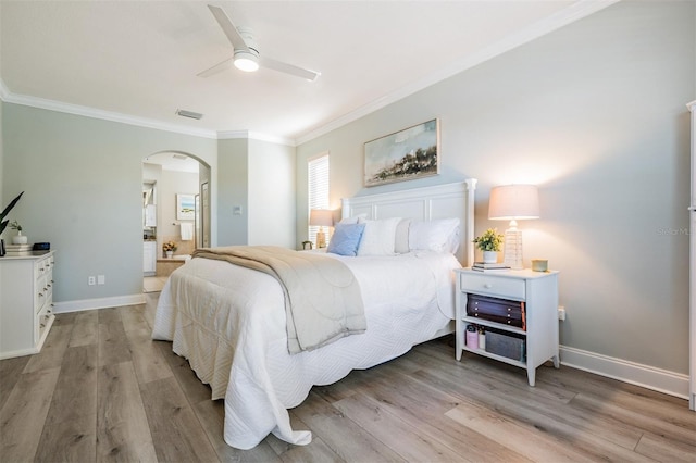 17927 Bahama Isle Cir, Tampa, FL 33647 - bedroom featuring light wood-style flooring, visible vents, ornamental molding, and arched walkways