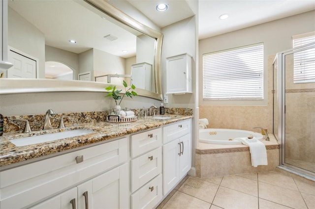 17927 Bahama Isle Cir, Tampa, FL 33647 - full bath featuring a stall shower, double vanity, a tub with jets, and a sink