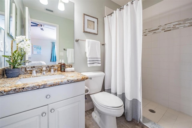 17927 Bahama Isle Cir, Tampa, FL 33647 - bathroom with tiled shower, toilet, vanity, visible vents, and a ceiling fan