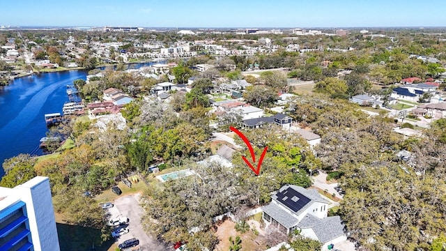 aerial perspective of suburban area with a nearby body of water