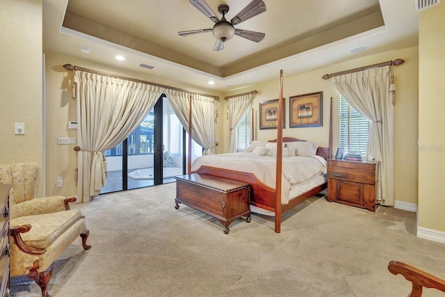 1108 W Charter St, Tampa, FL 33602 - bedroom with access to exterior, a raised ceiling, carpet flooring, multiple windows, and recessed lighting