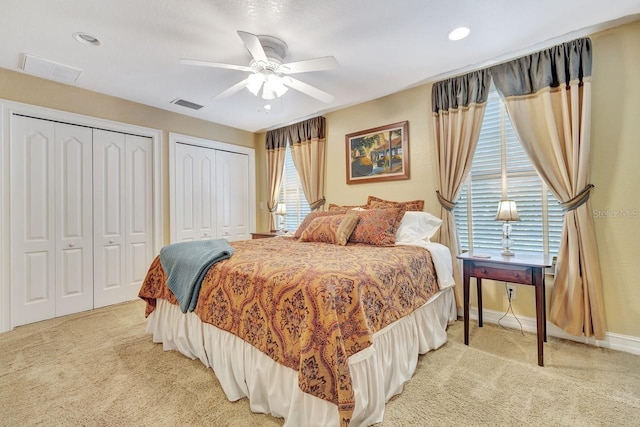 1108 W Charter St, Tampa, FL 33602 - bedroom featuring light colored carpet, multiple closets, ceiling fan, and baseboards