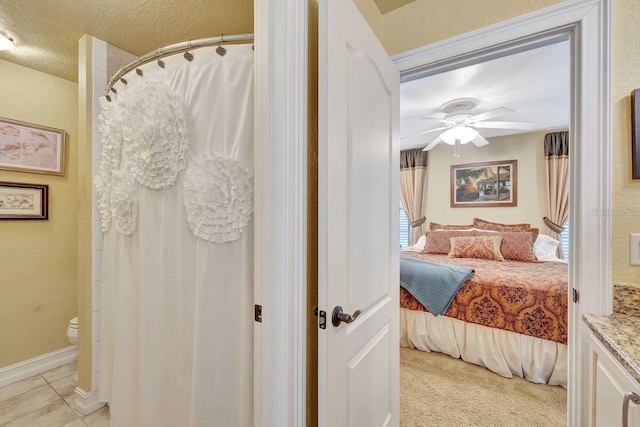 1108 W Charter St, Tampa, FL 33602 - bedroom featuring a textured ceiling, a ceiling fan, and connected bathroom