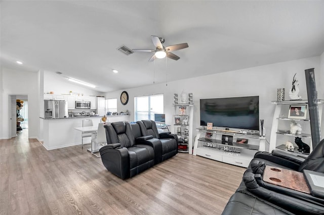 8528 Quarter Horse Dr, Riverview, FL 33578 - living room with ceiling fan, vaulted ceiling, light wood-style floors, and recessed lighting