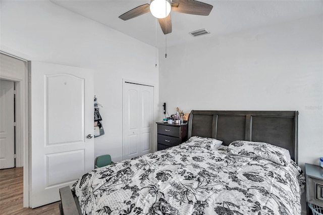 8528 Quarter Horse Dr, Riverview, FL 33578 - bedroom with wood finished floors, a closet, and a ceiling fan