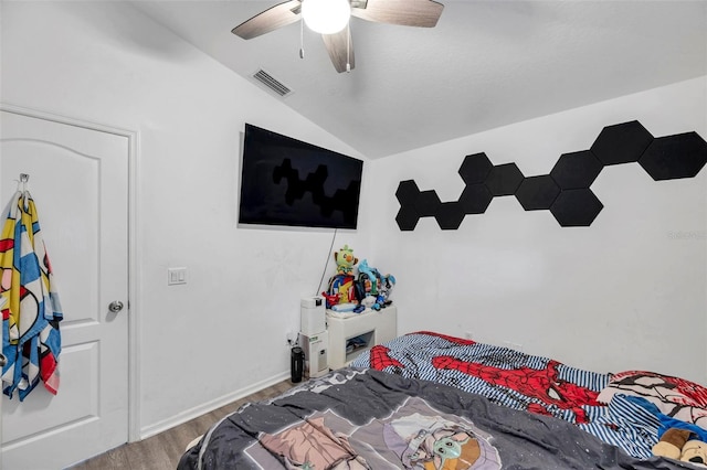 8528 Quarter Horse Dr, Riverview, FL 33578 - bedroom with vaulted ceiling, wood finished floors, and ceiling fan