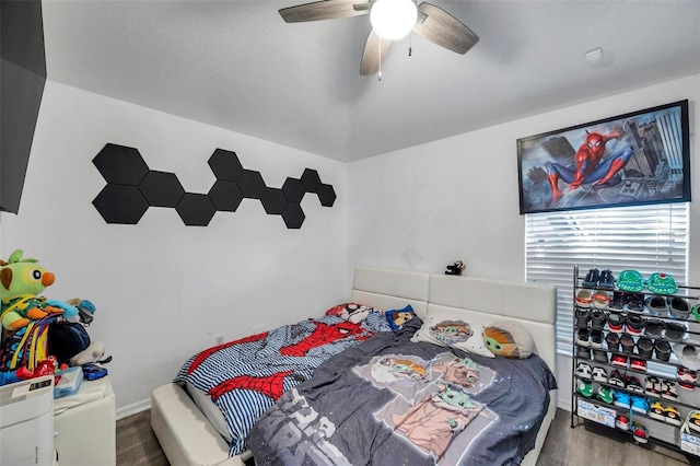 8528 Quarter Horse Dr, Riverview, FL 33578 - bedroom featuring wood finished floors and ceiling fan