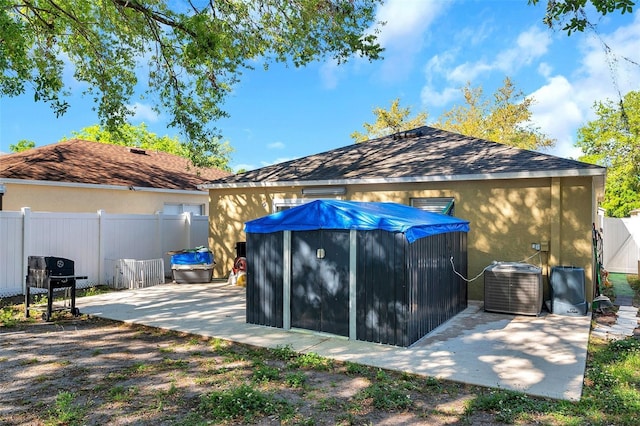 8528 Quarter Horse Dr, Riverview, FL 33578 - back of house with stucco siding, a patio area, and a shingled roof