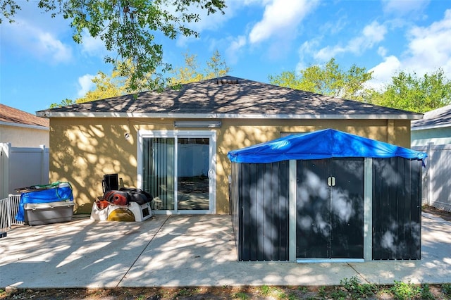 8528 Quarter Horse Dr, Riverview, FL 33578 - back of property featuring stucco siding, a patio area, and roof with shingles