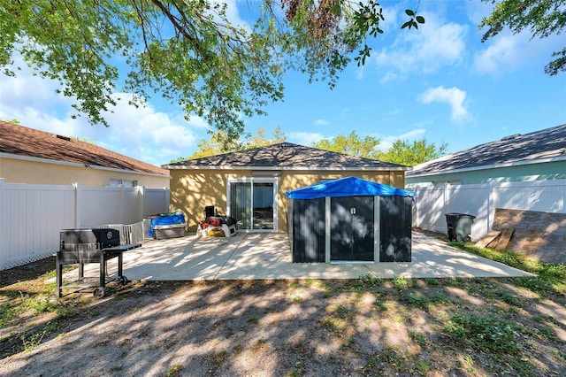8528 Quarter Horse Dr, Riverview, FL 33578 - rear view of house with a patio, a fenced backyard, and stucco siding