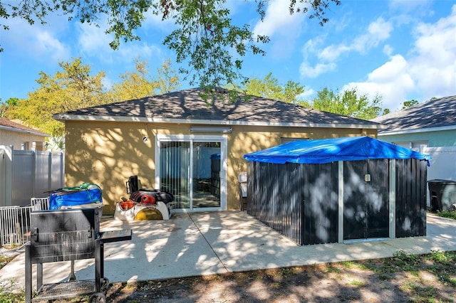 8528 Quarter Horse Dr, Riverview, FL 33578 - rear view of property featuring stucco siding and a patio area