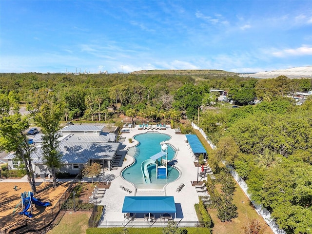 8528 Quarter Horse Dr, Riverview, FL 33578 - drone / aerial view of a pool area and a heavily wooded area