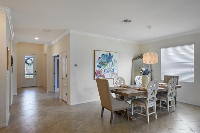 17541 Timberline Pkwy, Punta Gorda, FL 33982 - dining area featuring tile patterned flooring, crown molding, baseboards, and visible vents