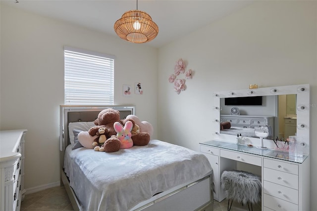 17541 Timberline Pkwy, Punta Gorda, FL 33982 - bedroom featuring baseboards and light tile patterned floors