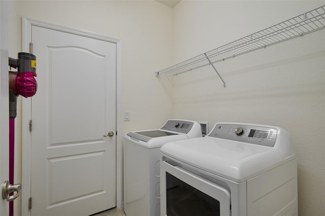 17541 Timberline Pkwy, Punta Gorda, FL 33982 - washroom featuring washing machine and clothes dryer and laundry area
