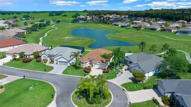 birds eye view of property with a residential view and a water view