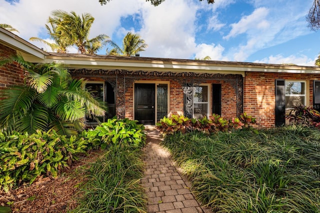 exterior space featuring brick siding