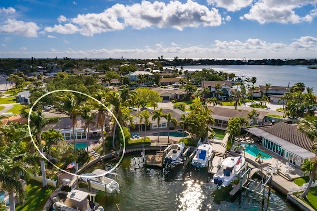bird's eye view featuring a water view and a residential view