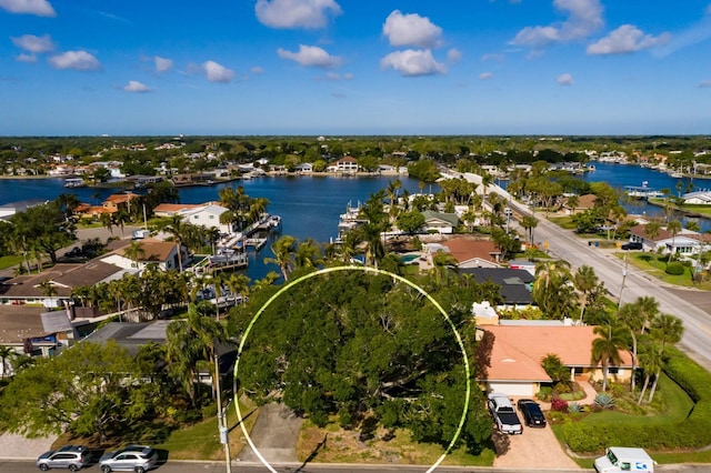 drone / aerial view with a residential view and a water view
