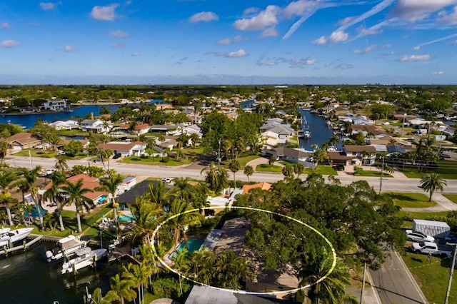 bird's eye view featuring a water view and a residential view