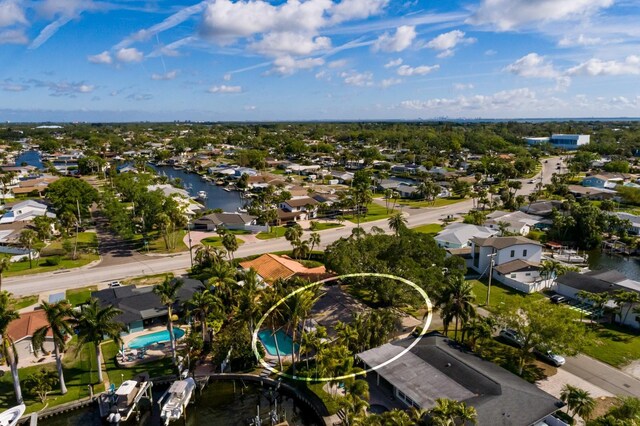 aerial view with a residential view and a water view