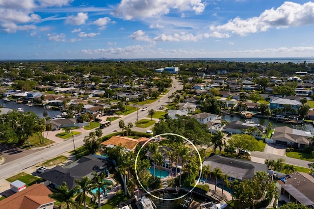 birds eye view of property with a residential view and a water view