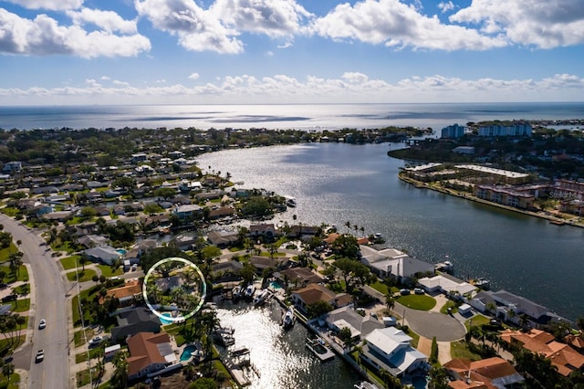 drone / aerial view featuring a residential view and a water view