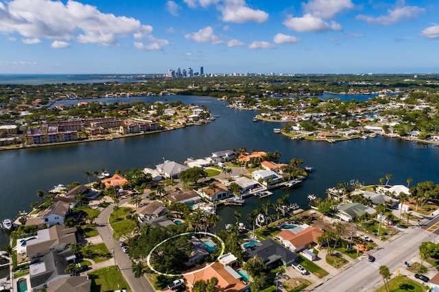 drone / aerial view featuring a residential view and a water view