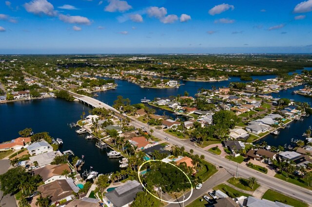 birds eye view of property featuring a residential view and a water view