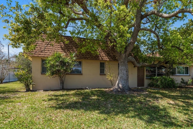 8445 Calais N, Pinellas Park, FL 33781 - view of front of property featuring stucco siding and mansard roof