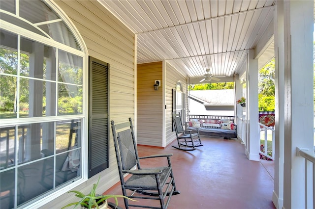 view of patio with a ceiling fan and a porch