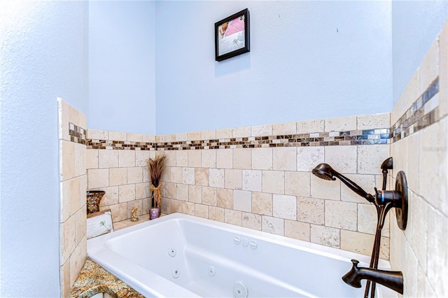 full bath with a tub with jets