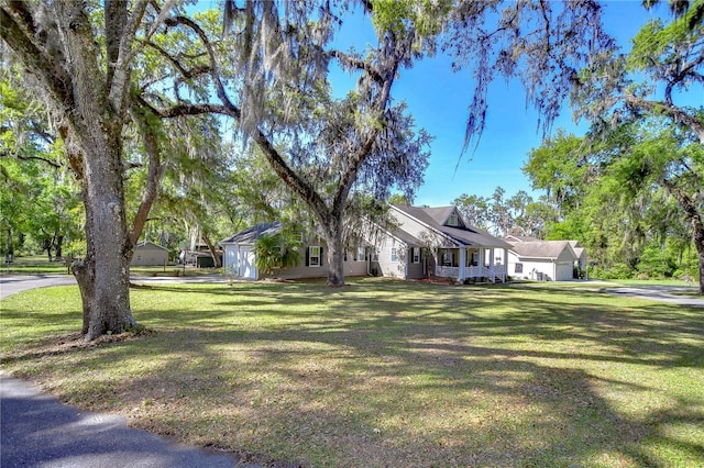 view of front of house with a front lawn and a garage