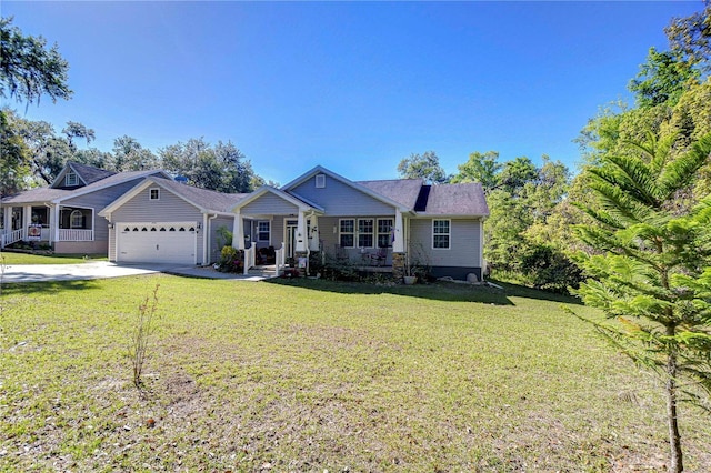 view of front of house with a garage, concrete driveway, and a front yard