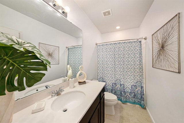 30364 Marquette Ave, Wesley Chapel, FL 33545 - full bathroom with toilet, vanity, tile patterned flooring, baseboards, and visible vents