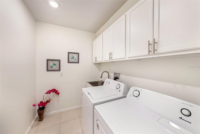 30364 Marquette Ave, Wesley Chapel, FL 33545 - clothes washing area featuring light tile patterned floors, baseboards, a sink, cabinet space, and washer and dryer