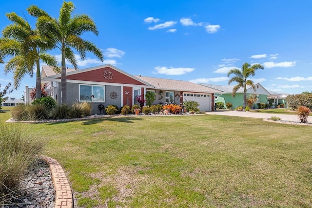 single story home with a front yard, driveway, and an attached garage