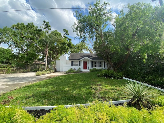 3204 W Clinton St, Tampa, FL 33614 - view of front of house with driveway and a front yard