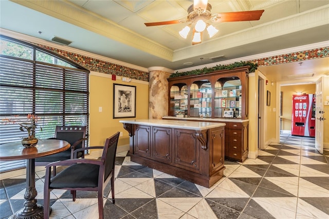 100 4th Ave S Unit 220, Saint Petersburg, FL 33701 - bar area featuring crown molding, ceiling fan, a tray ceiling, and tile patterned floors