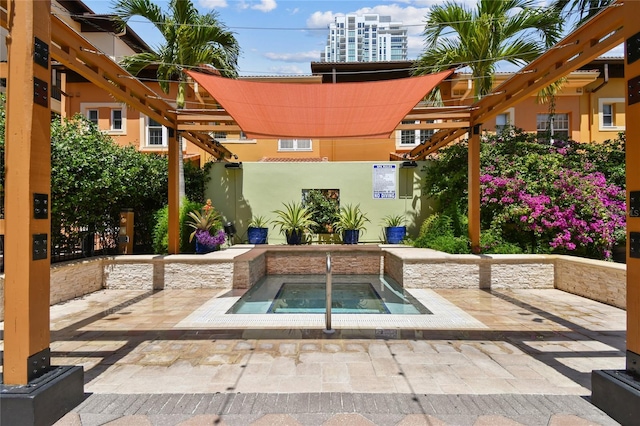 100 4th Ave S Unit 220, Saint Petersburg, FL 33701 - view of patio / terrace with a community hot tub