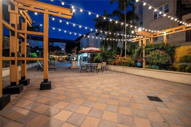 100 4th Ave S Unit 220, Saint Petersburg, FL 33701 - patio at twilight with outdoor dining space and a patio area