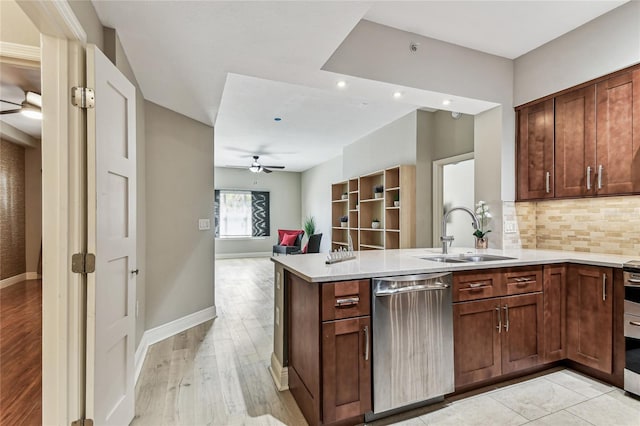 100 4th Ave S Unit 220, Saint Petersburg, FL 33701 - kitchen with stainless steel dishwasher, ceiling fan, a peninsula, backsplash, and recessed lighting