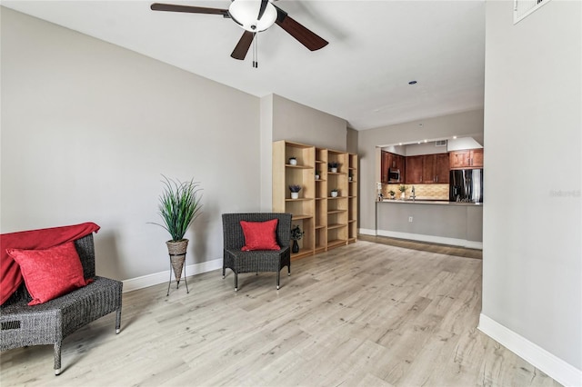 100 4th Ave S Unit 220, Saint Petersburg, FL 33701 - sitting room featuring light wood-style floors and ceiling fan