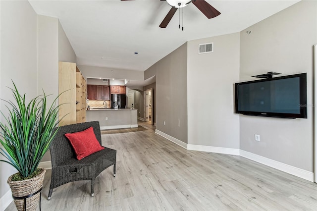 100 4th Ave S Unit 220, Saint Petersburg, FL 33701 - sitting room with ceiling fan, light wood finished floors, and arched walkways