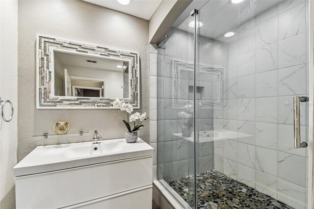 100 4th Ave S Unit 220, Saint Petersburg, FL 33701 - full bath featuring vanity, a shower stall, recessed lighting, and a textured wall
