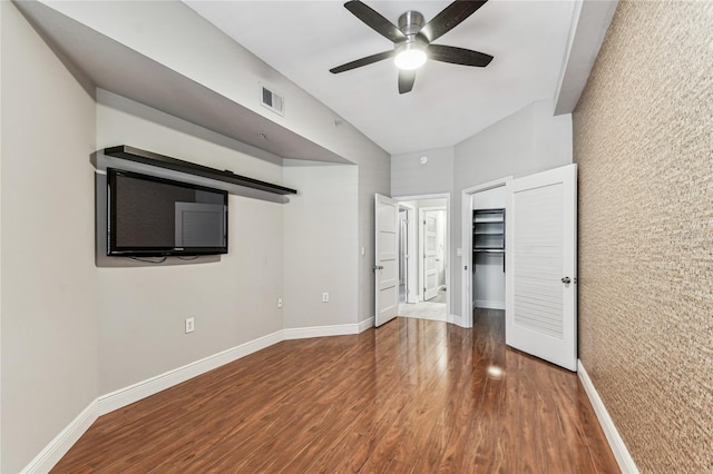 100 4th Ave S Unit 220, Saint Petersburg, FL 33701 - unfurnished bedroom featuring wood finished floors, a walk in closet, and ceiling fan
