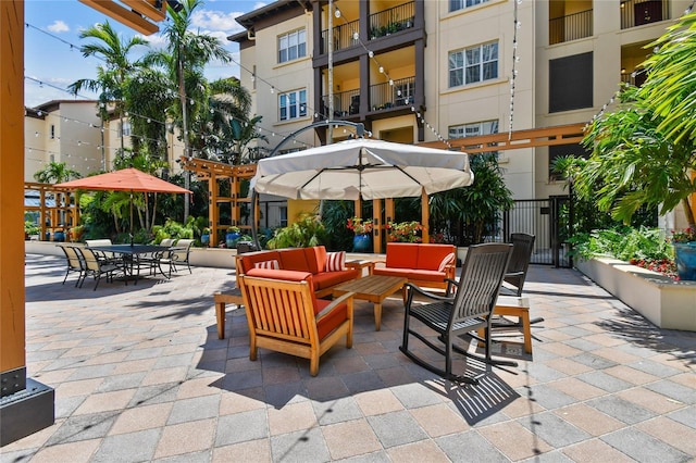 100 4th Ave S Unit 220, Saint Petersburg, FL 33701 - view of patio with outdoor lounge area and a gate